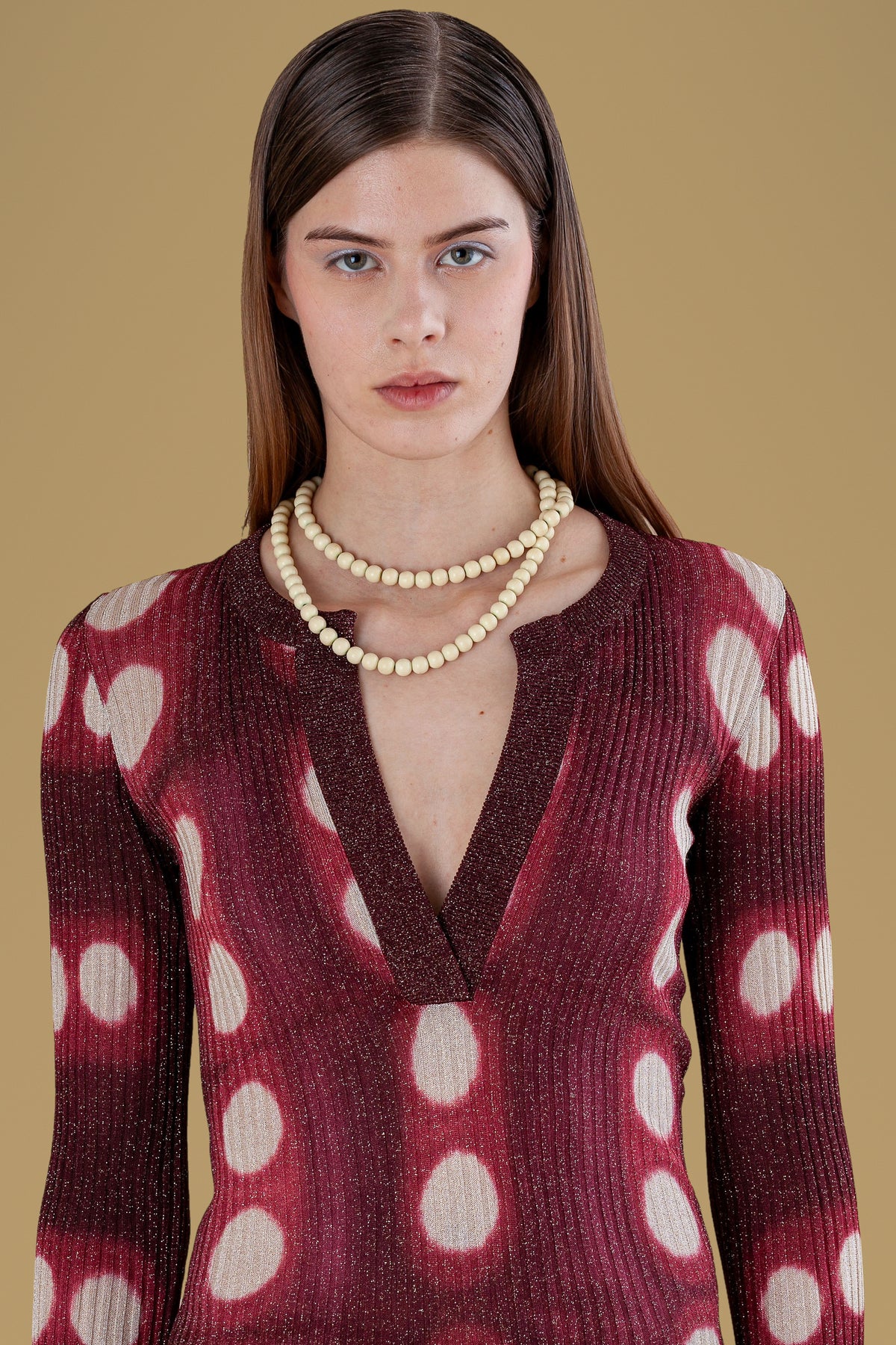 Front bust of burgundy henley with grandad collar and tie-dyed circles