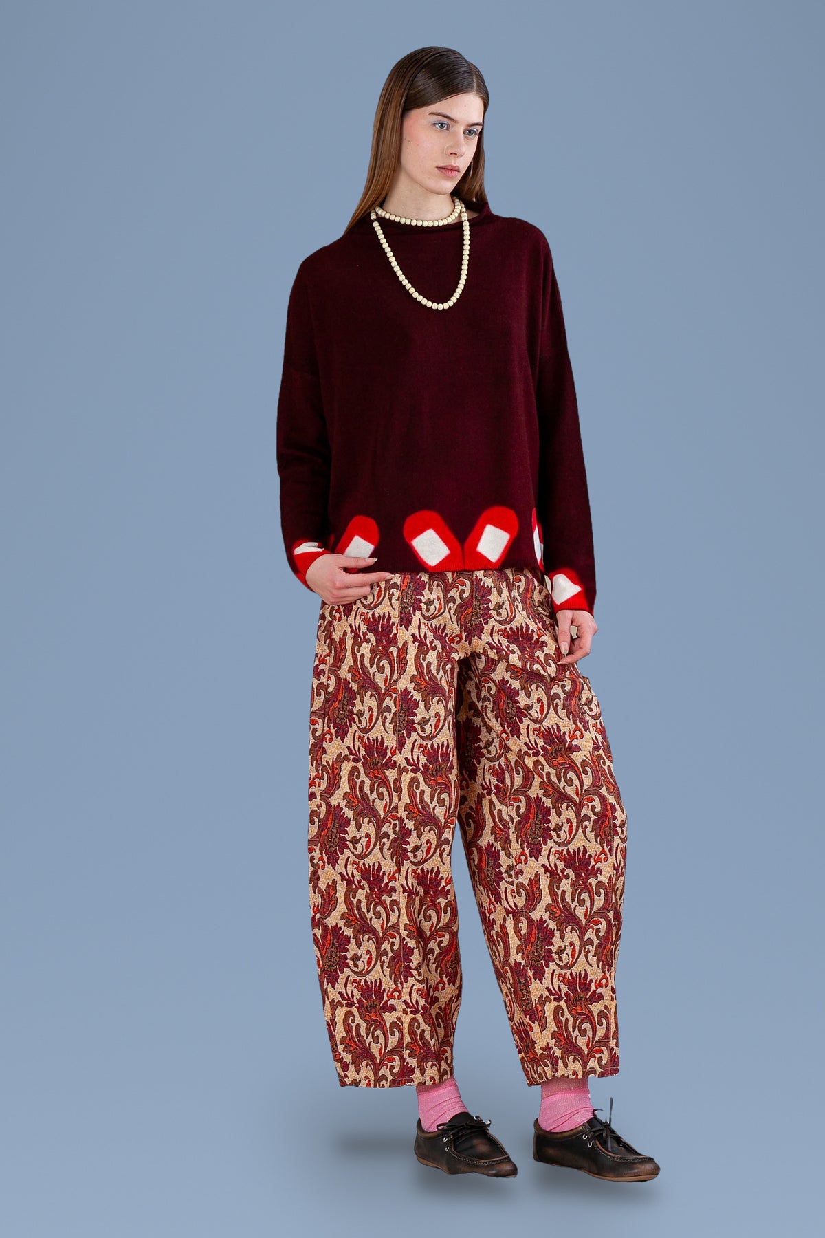 Burgundy high neck sweater with tie-dyed diamond hem, front view