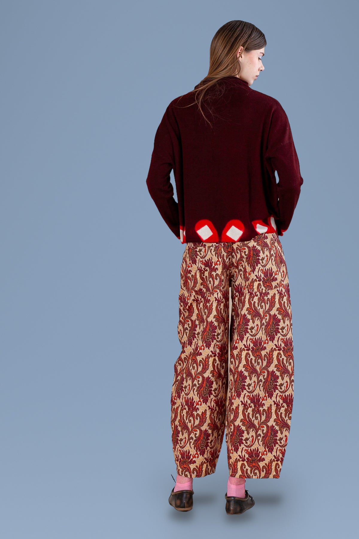 Burgundy sweater with tie-dyed hem, back view