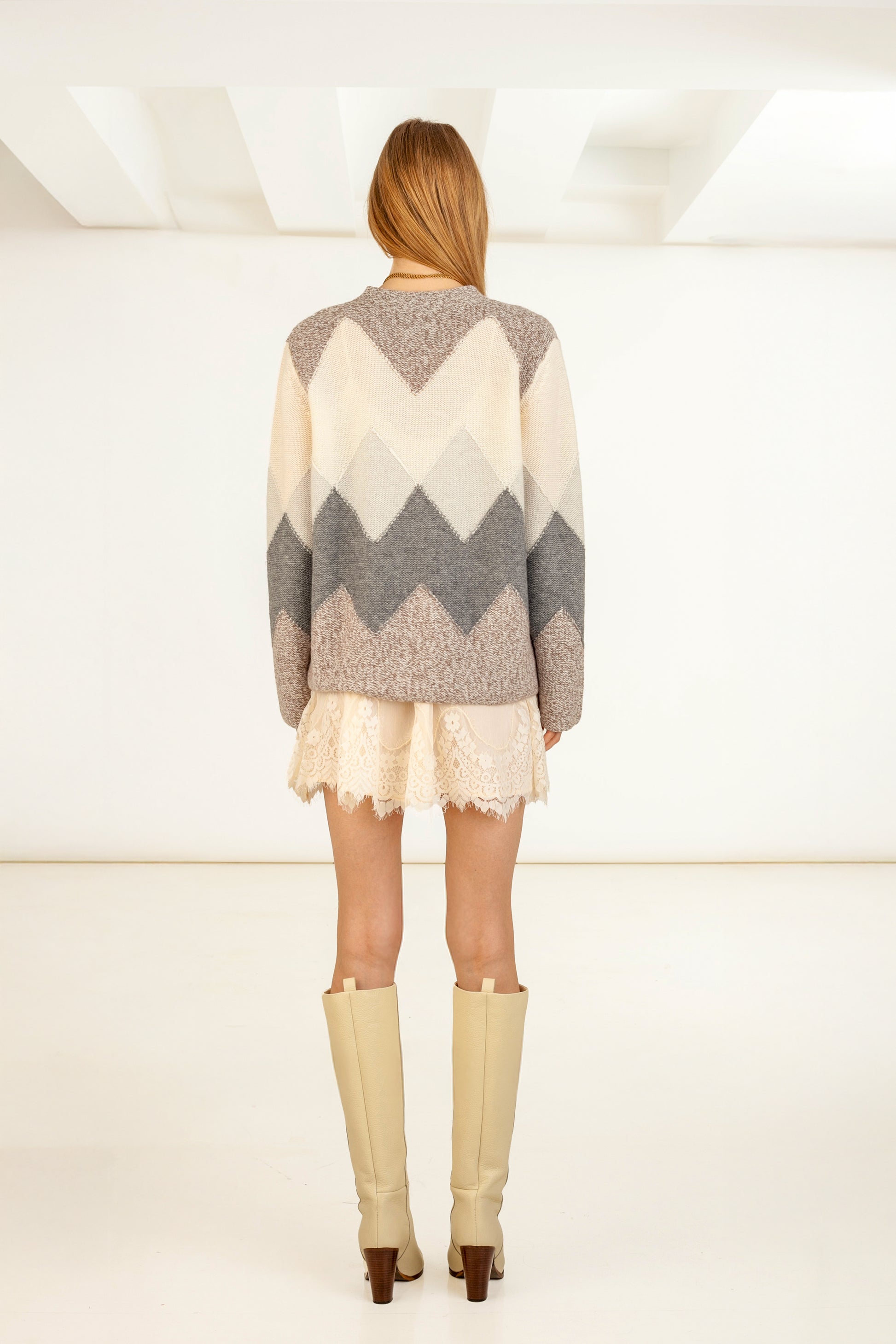 Chevron Intarsia Cashmere Wool Cardigan front view – Happy Sheep

Detail of reversed knit chevron pattern – Chevron Cashmere cardigan

Chevron Cashmere cardigan back view – Happy Sheep

Close-up texture of cashmere wool knit – Chevron Intarsia Cardigan