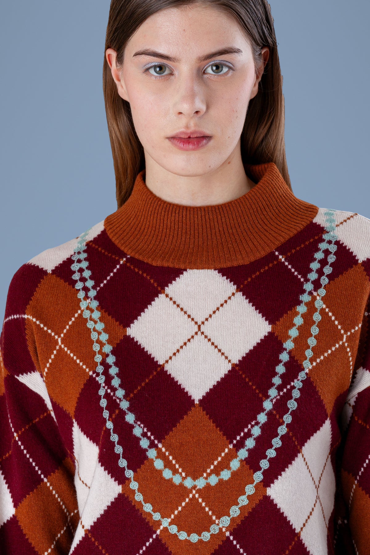 Pearl Necklace Argyle Mock Neck · Rust · half-length