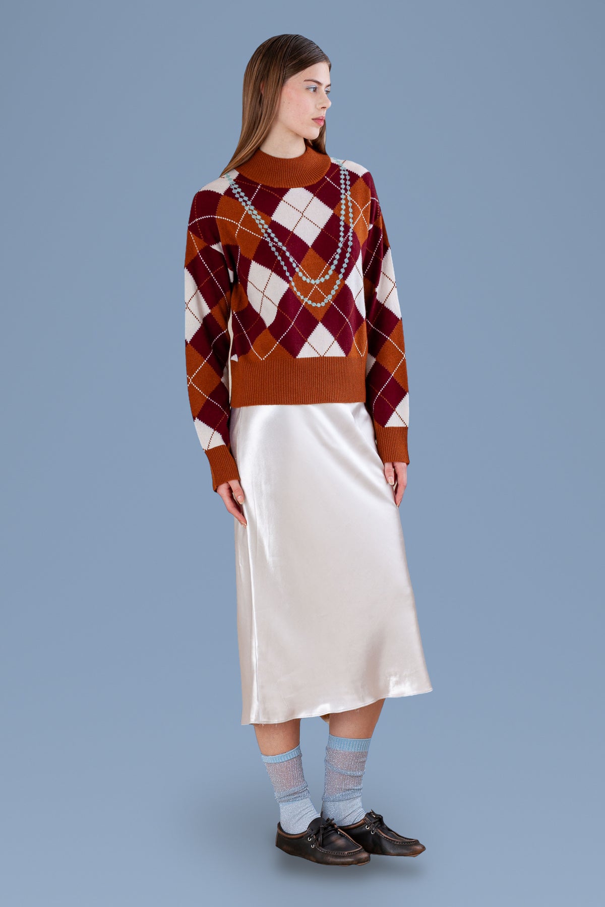 Pearl Necklace Argyle Mock Neck · Rust · three-quarter view