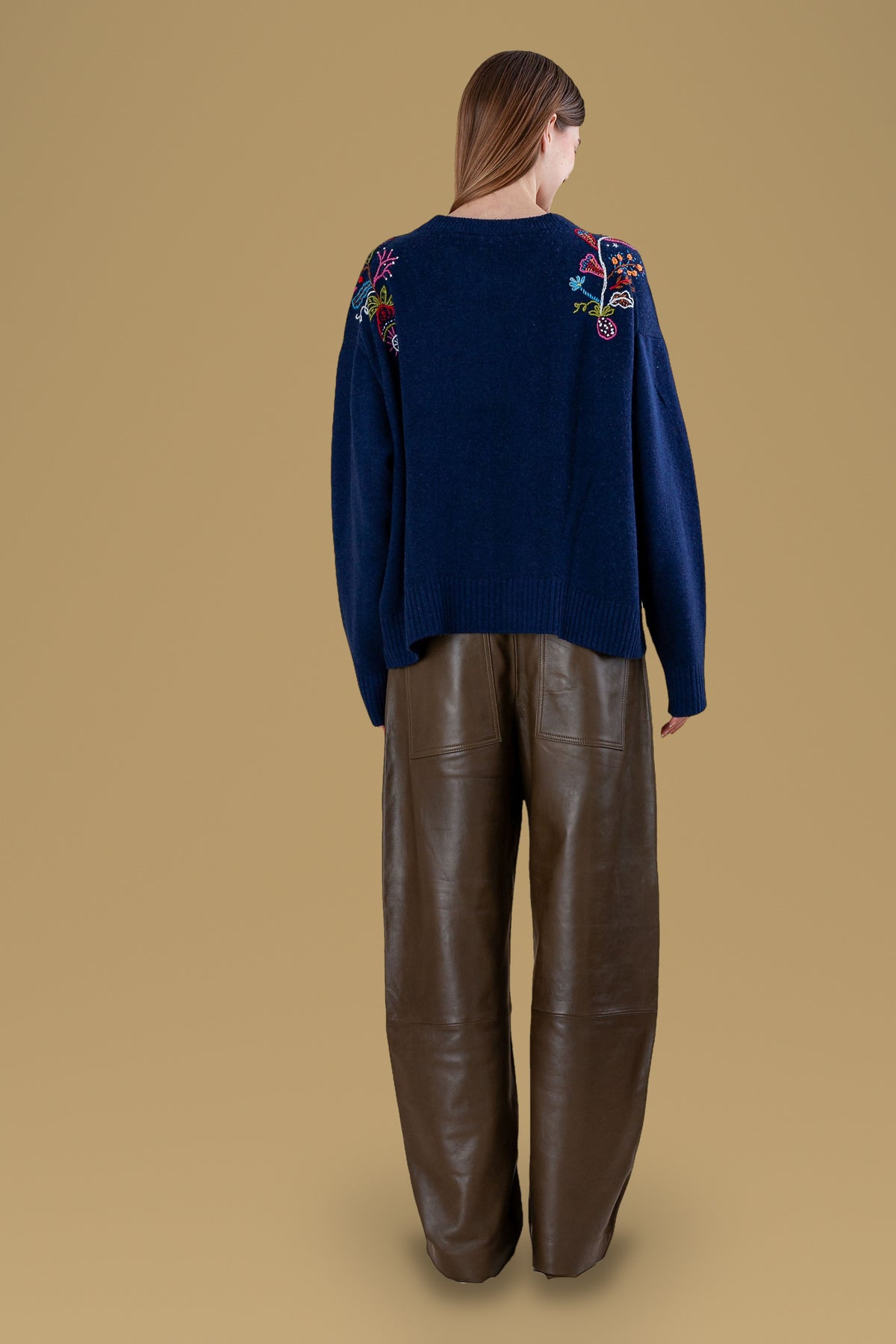 Navy relaxed crew sweater, back view with embroidered shoulders