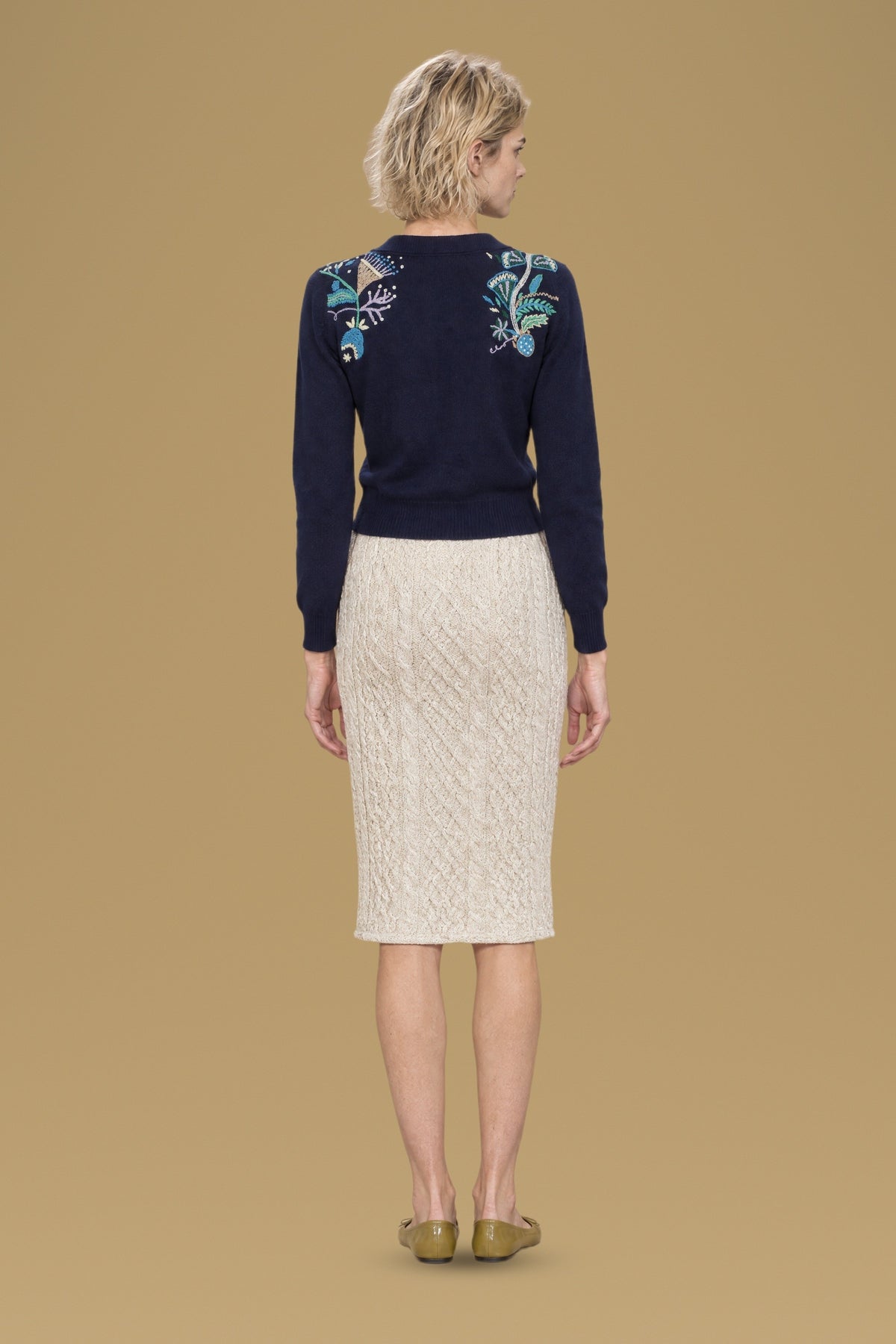 Navy Rebecchina cardigan, back view, hand embroidery on both shoulders