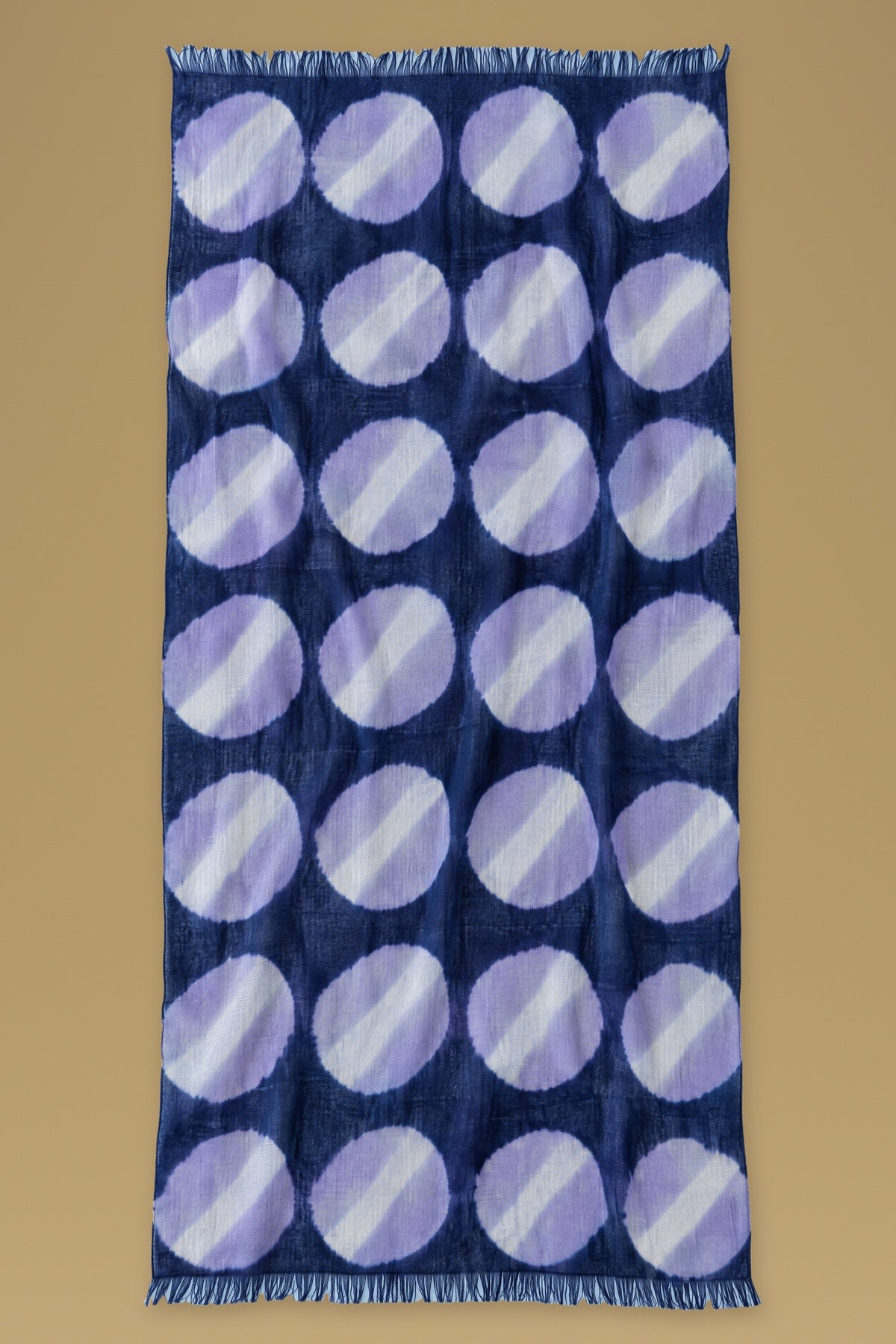 Navy cashmere scarf with hand tie-dyed lilac circles, laid open with fringed ends